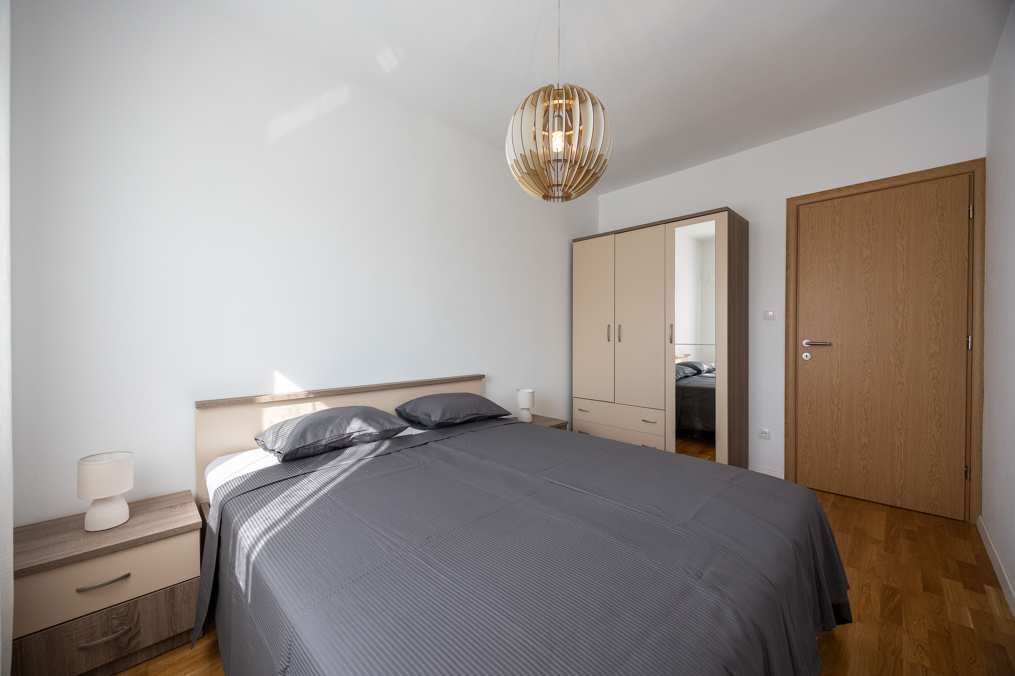 Master bedroom with double bed and wardrobe