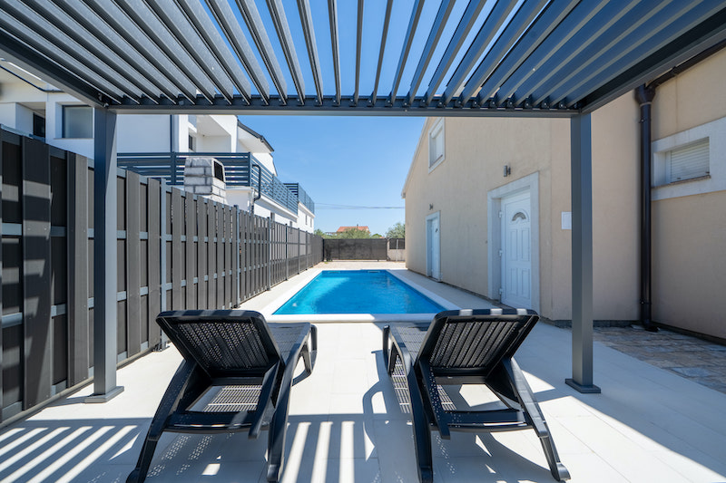 Pool area with sun loungers